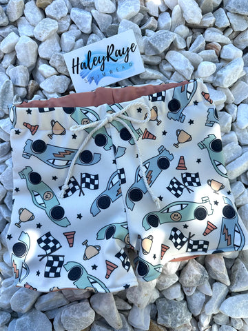 BOY SWIM SHORTS: TRUCK PRINT
